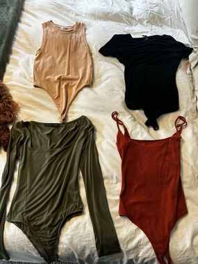 4 womens bodysuits, all great condition!